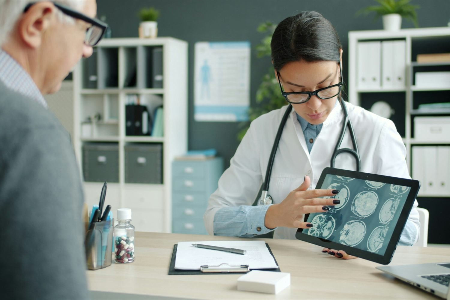 A nurse practitioner and patient talking together in a quiet consulting room