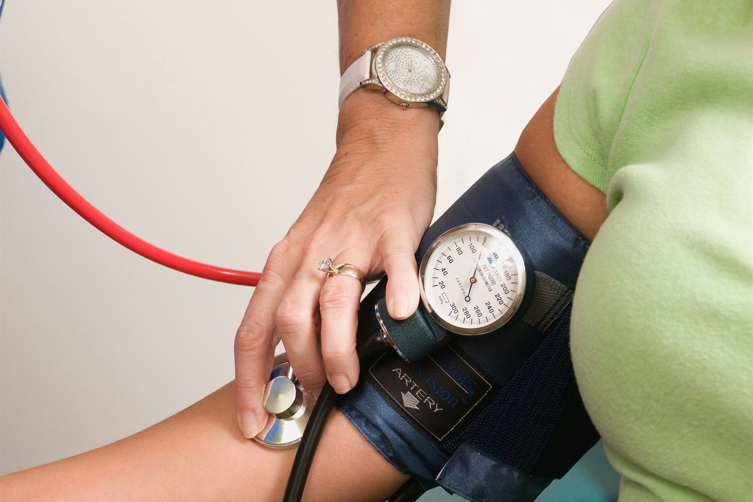 A nurse practitioner reviewing a chart with a patient